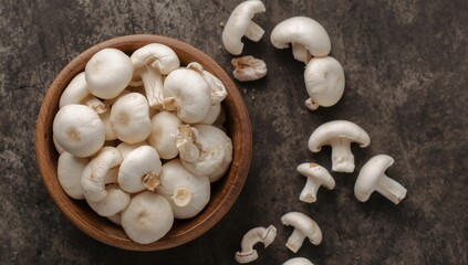 Still Life with Fungi in a Wooden Bowl White Caps and Earthen Texture Abound.