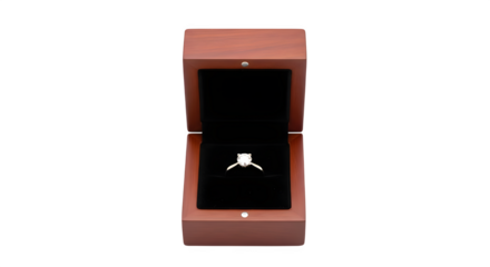 A sparkling diamond ring sits elegantly inside an open wooden box, the black velvet interior accentuating its brilliance, isolated on transparent background a symbol of love and commitment
