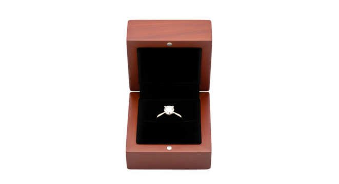 A sparkling diamond ring sits elegantly inside an open wooden box, the black velvet interior accentuating its brilliance, isolated on transparent background a symbol of love and commitment