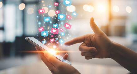 Person s hand holding smartphone with social media icons floating upwards