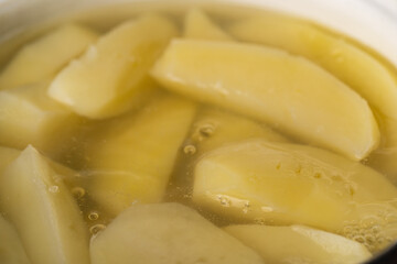 Close Up Sliced Potatoes Boiling in Hot Water