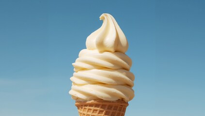 A Delightful Creamy Swirl Cone Against a Pale Blue Sky, a Study in Textures and Forms.