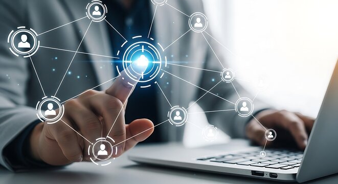 Businessman touching a digital network of people on a laptop