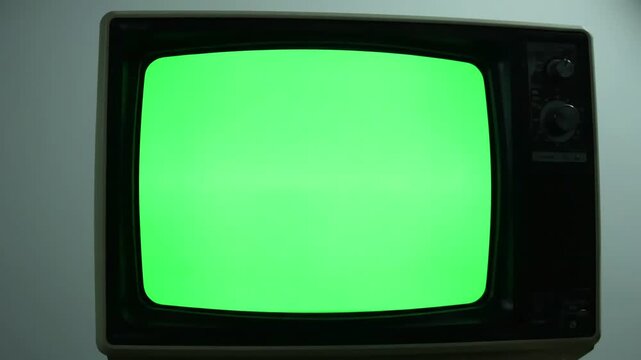 CRT Screen Transition with old tv turning on green for video masking distortion, overlay, glitch, static noise, scan lines black background, 4k animated loop