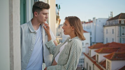 Obraz premium Romantic couple talking terrace in evening. Lovely sweethearts flirting on date