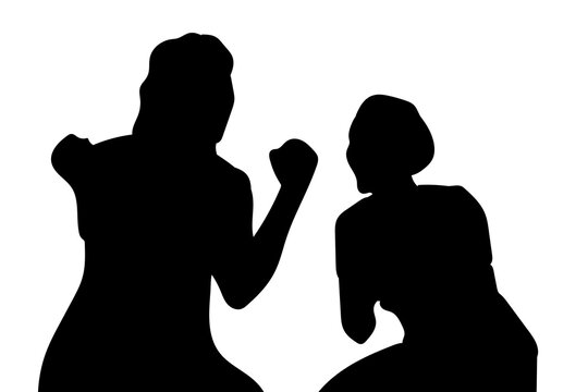 Two silhouettes of female soccer players talking and celebrating in a congratulatory manner after a goal