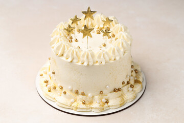 Delicious cake with Christmas decor on beige table, closeup