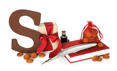 Saint Nicholas (Sinterklaas) day. Inkwell, feather, book, chocolate letter S, kruidnoten cookies and gift box isolated on white