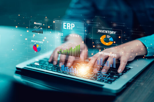 Business ERP system dashboard with glowing data analytics, finance charts, and management reports on laptop. Concept of enterprise planning and digital transformation.