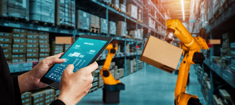 Smart robot arm systems for innovative warehouse and factory digital technology . Automation manufacturing robot controlled by industry engineering using IOT software connected to internet network .