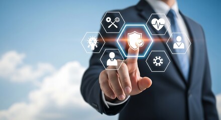 Businessman touching a shield icon representing security and protection