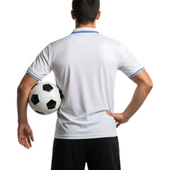 Rear view of a male soccer player holding a ball against a black background