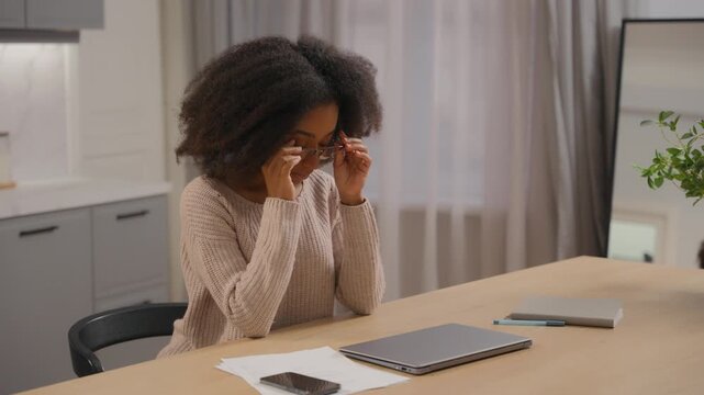 African American business woman female girl feeling eyes discomfort finishing online task closing laptop at home tired businesswoman close computer take off glasses dry eyes complete job done headache