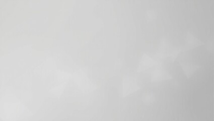Obraz premium A blurry gray background with a few white circles. The background is mostly gray with some white