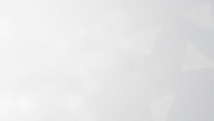 A blurry gray background with a few white circles. The background is mostly gray with some white