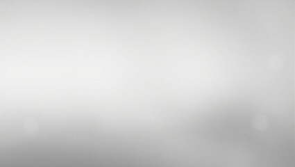 A blurry gray background with a few white circles. The background is mostly gray with some white