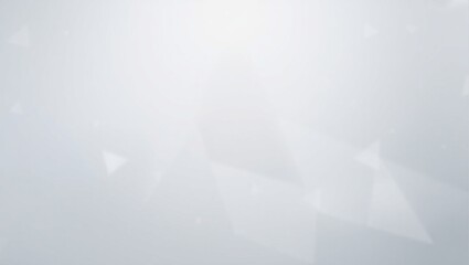 A blurry gray background with a few white circles. The background is mostly gray with some white