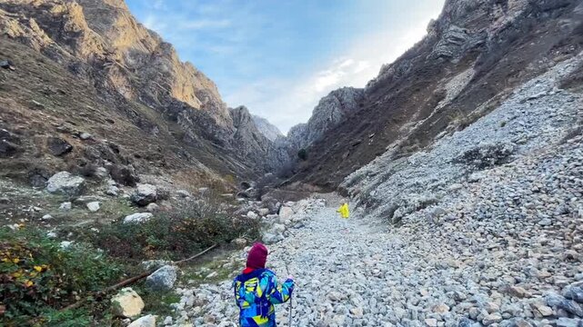 child is hiking in a mountain gorge