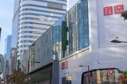 looking south on Yonge St to facade of CF Toronto Eaton Centre at feat signs of UNIQLO, La Maison Simons, and Eataly an Italian restaurant and market