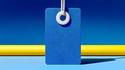 Blue tag with a white circle in the middle. The tag is hanging from a string