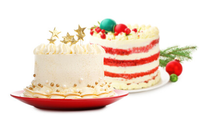 Delicious cakes with Christmas decor isolated on white