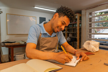 Latin American man planning his small business finances