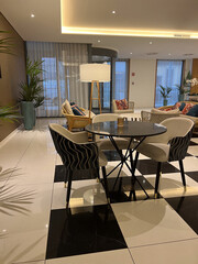 modern hotel lobby lounge with checkered floor, plants, concept of hospitality, travel, banner