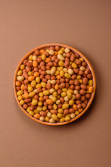 Food, nuts coated with salt and paprika, peanuts as a source of protein. Salted peanuts