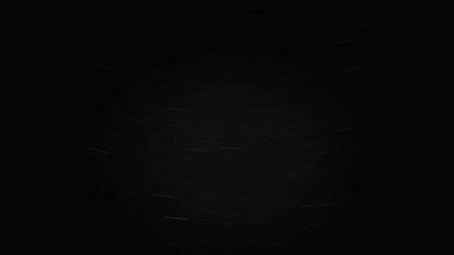 Glitter covered vinyl record spinning in the dark