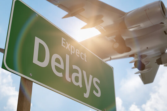 Fototapeta Expect Delays Green Road Sign with Airplane Above.
