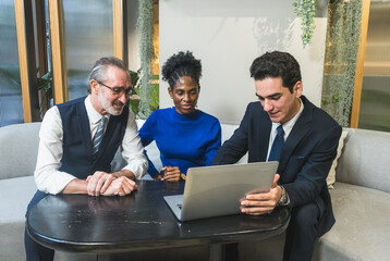 business meeting discussion among people seat around table modern office laptop on table convey collaboration communication relax working environment making suitable content related team office life.