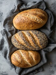 A loaf of wheat bread with sesame seeds.