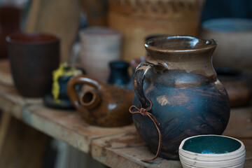 clay vase and other handmade products on the table