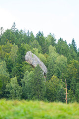 a huge rock massif among the forests
