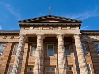 Historic Old State Capitol Building with Red Dome in Springfield, Illinois on a Sunny Day (close-up view of the pillars)