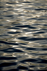Shiny abstract ornament from the sun light on the sea surface