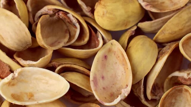 Pistachio nuts shells texture circle rotation close up