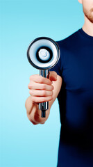 Close-up of man holding megaphone on blue background, symbol of leadership, motivation and public communication.