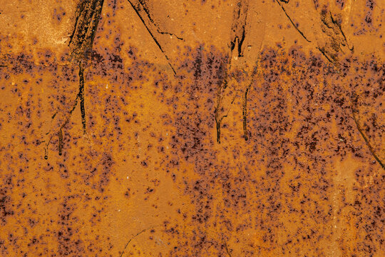 Vibrant orange rust abstract metal texture.