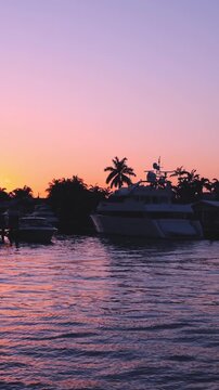 Yachts and sailboats in Fort Lauderdale canals in Florida at sunset