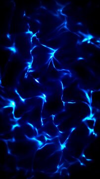 Blue light moves through the dark water. Looks like bioluminescence, a natural light production.