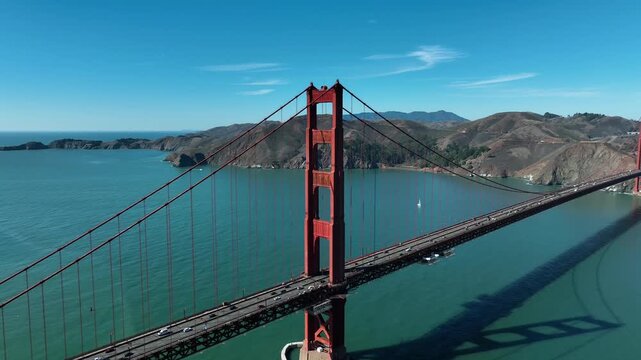 San Francisco, California, USA, June 5, 2025 - Drone video of the Golden Gate Bridge, Marin Headlands, and San Francisco Bay featuring blue water, coastal cliffs, and clear summer skies