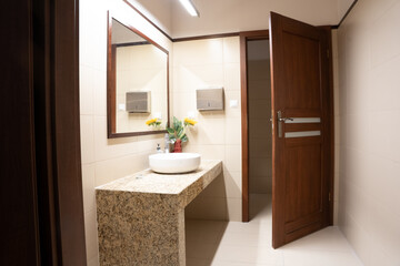 Modern white and brown Bathroom Interior with Sink, Mirror and white tiles