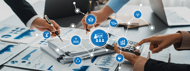 Collaborative Business Strategy Meeting with Data Analysis and Visual Representation of Digital Marketing Concepts in Modern Office Environment. Amity