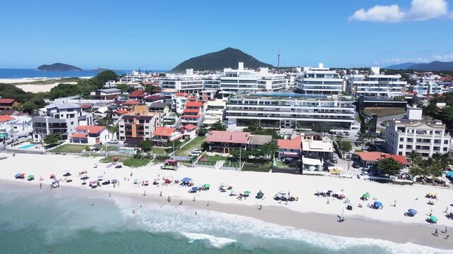 Panoramic aerial view of Ingleses beach in Florianópolis, Santa Catarina, an urban complex on the coast, city master plan, neighborhoods and real estate developments facing the sea.