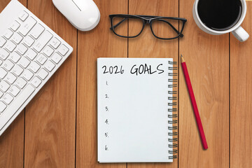 2026 Happy New Year Resolution Goal List and Plans Setting - Business office desk with notebook written about plan listing of new year goals and resolutions setting. Change and glee concept.