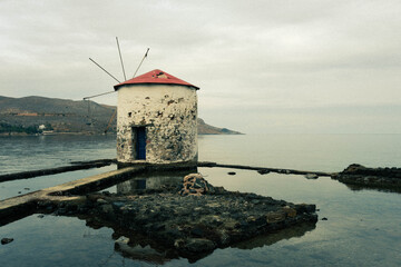 Greece Island, traditional windmill in the sea on Leros Island