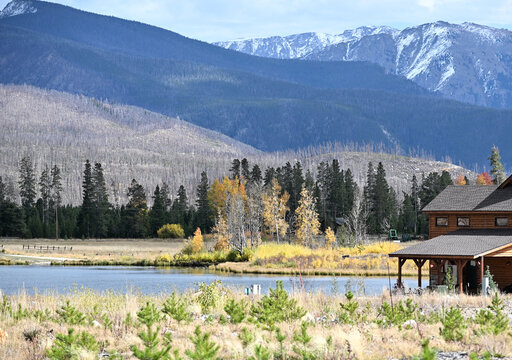 Cabin by Lake in the Mountains - Powered by Adobe