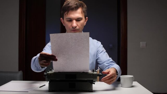 man reviews document, author concentrating on editing manuscript in quiet evening setting