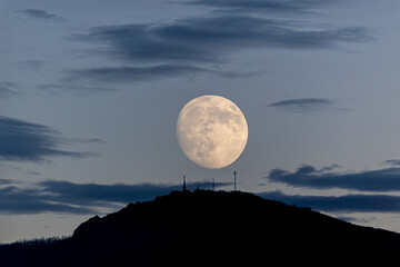 Photographing big waves, birds flying at sea, and the almost full moon!